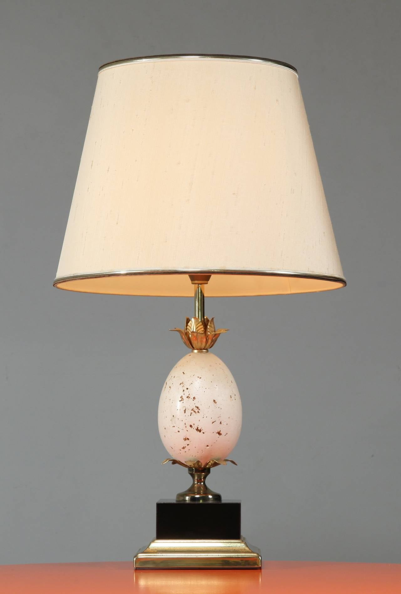 Set of table or console lamp in the manner of Maison Charles. 
Brass and marble base with travertine sotrich egg.
To be on the the safe side, the lamp should be checked locally by a specialist concerning local requirements.
