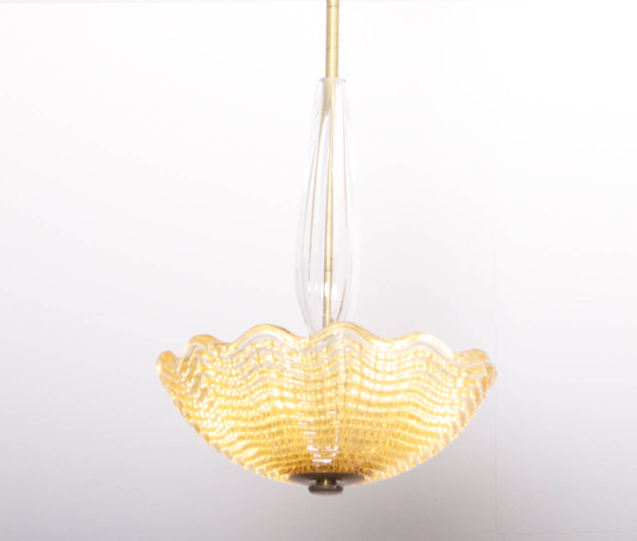 Bowl shaped chandelier by Carl Fagerlund for Orrefors of Sweden, in pressed glass with glass stem and brass fitments.
To be on the the safe side, the lamp should be checked locally by a specialist concerning local requirements.


