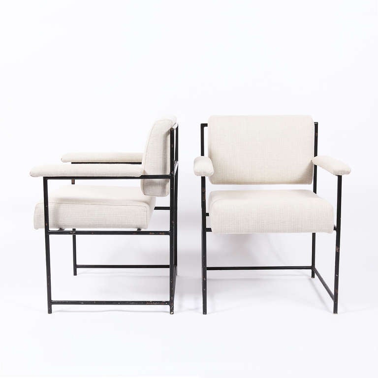 Pair of armchairs designed by Geraldo de Barros and manufactured by his company Unilabor, c. 1955. Black-lacquered metal structure and brand new crème upholstery.

The metal has multiple cracks and paint losses, however we have decided not to