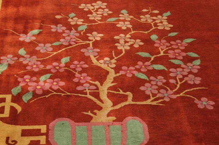 Beautiful wool carpet handknotted in China mainly during the 1920s and 1930s. Colors are bright and bold. Designs are simple but very decorative: a thick border with floral arrangement stretched toward the center of the rug.