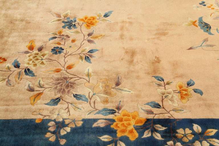 Beautiful wool carpet handknotted in China mainly during the 1920s and 1930s. Colors are bright and bold. Designs are simple but very decorative: a thick border with floral arrangement stretched toward the center of the rug.