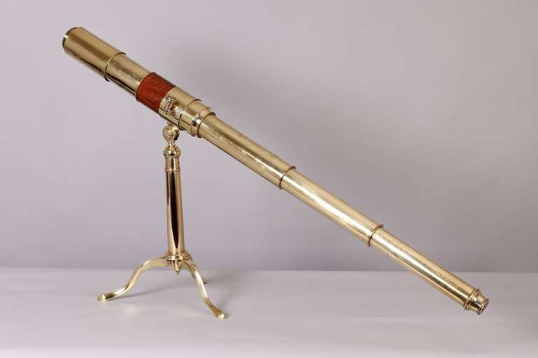 Early 19th century brass three-draw 'Day & Night' refracting telescope by Dollond of London; a gentleman's library telescope with a mahogany barrel, and its stand with a hinged annulus with a locking-screw and folding cabriole legs. 2