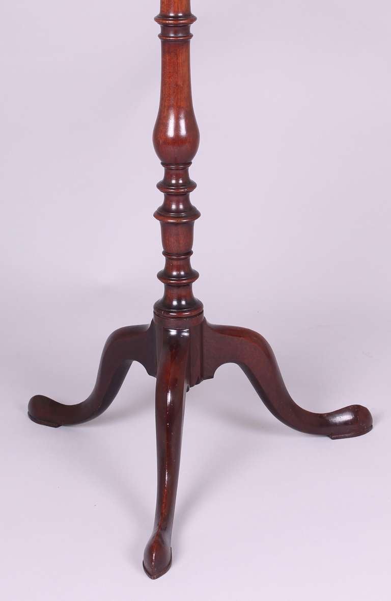 Mahogany torchere with an octagonal galleried top, standing on an elegant tripod stand with a turned baluster shaft, 

circa 1770.