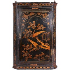Early 18th century black and gold japanned corner-cupboard