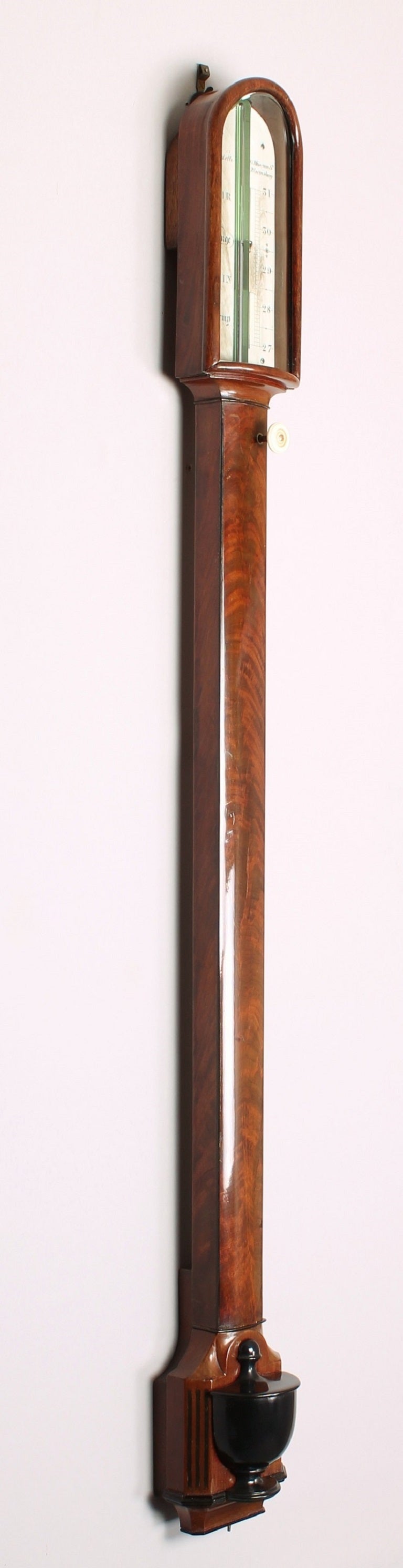 Fine early 19th century stick barometer by J. Ronketti, 15 Museum St., Bloomsbury; the richly-coloured bow-fronted mahogany case with ebony stringing, the ivory registers enclosed by an arched front with bowed glass and fitted with an ivory-knob