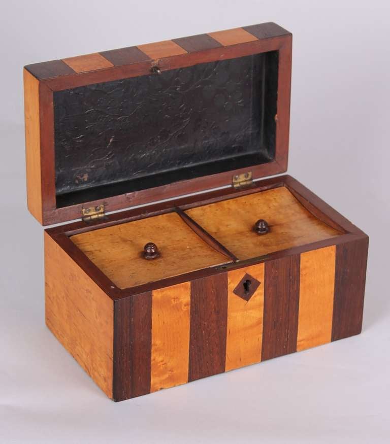 Early Victorian bird's-eye maple and rosewood striped double tea-caddy, circa 1840.