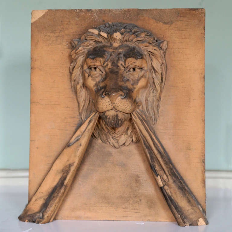 An artificial stone keystone modelled in high relief with a lion's mask.

Available to view at Brunswick House