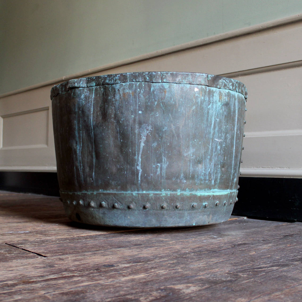 A nineteenth century riveted copper vat, with well patinated exterior.

Available to view at Brunswick House, London.

Diameter 65cm, height 46cm.