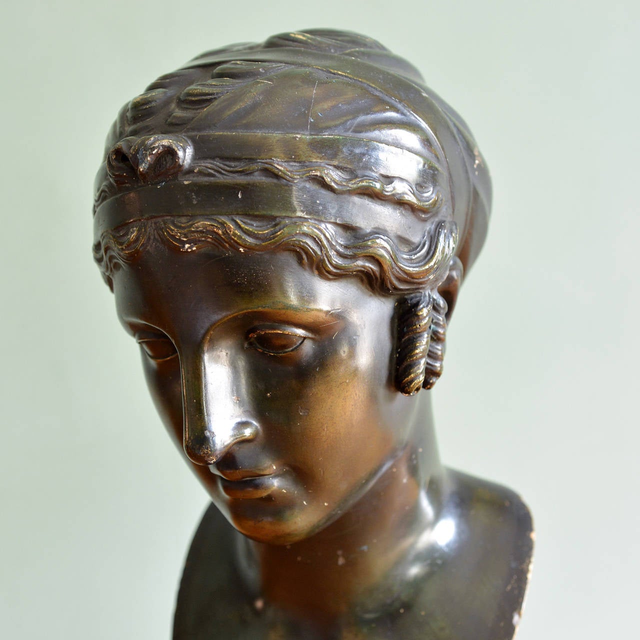 A bronze finish plaster bust of a female, early twentieth century, modeled with bound hair.

Available to view at Brunswick House, London.

Height 51cm, width 20cm.