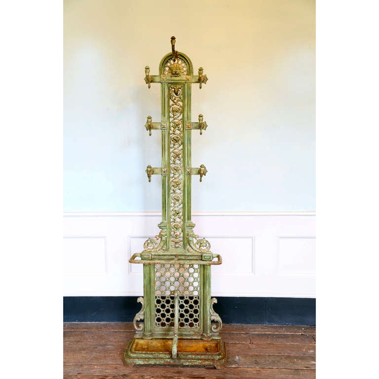 A Victorian cast iron hall stand with lion head detail, seven hooks, and compartment for umbrellas, in old green paint.

This has been reduced to £1,100 in our Autumn Sale

Available to view at Brunswick House, London.