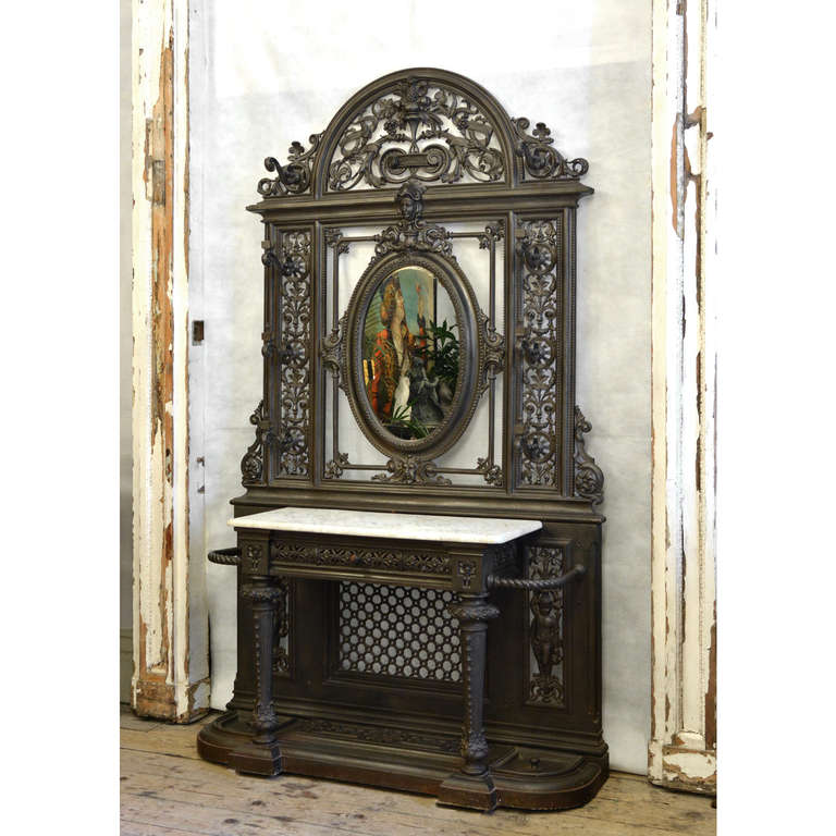 A Victorian cast iron hallstand, attributed to Yates, Haywood & Co. of Rotherham, a similar design being exhibited at the 'Masterpieces of Industrial Art and Sculpture' at the Great Exhibition in 1862.

Dated with diamond registration mark 6th