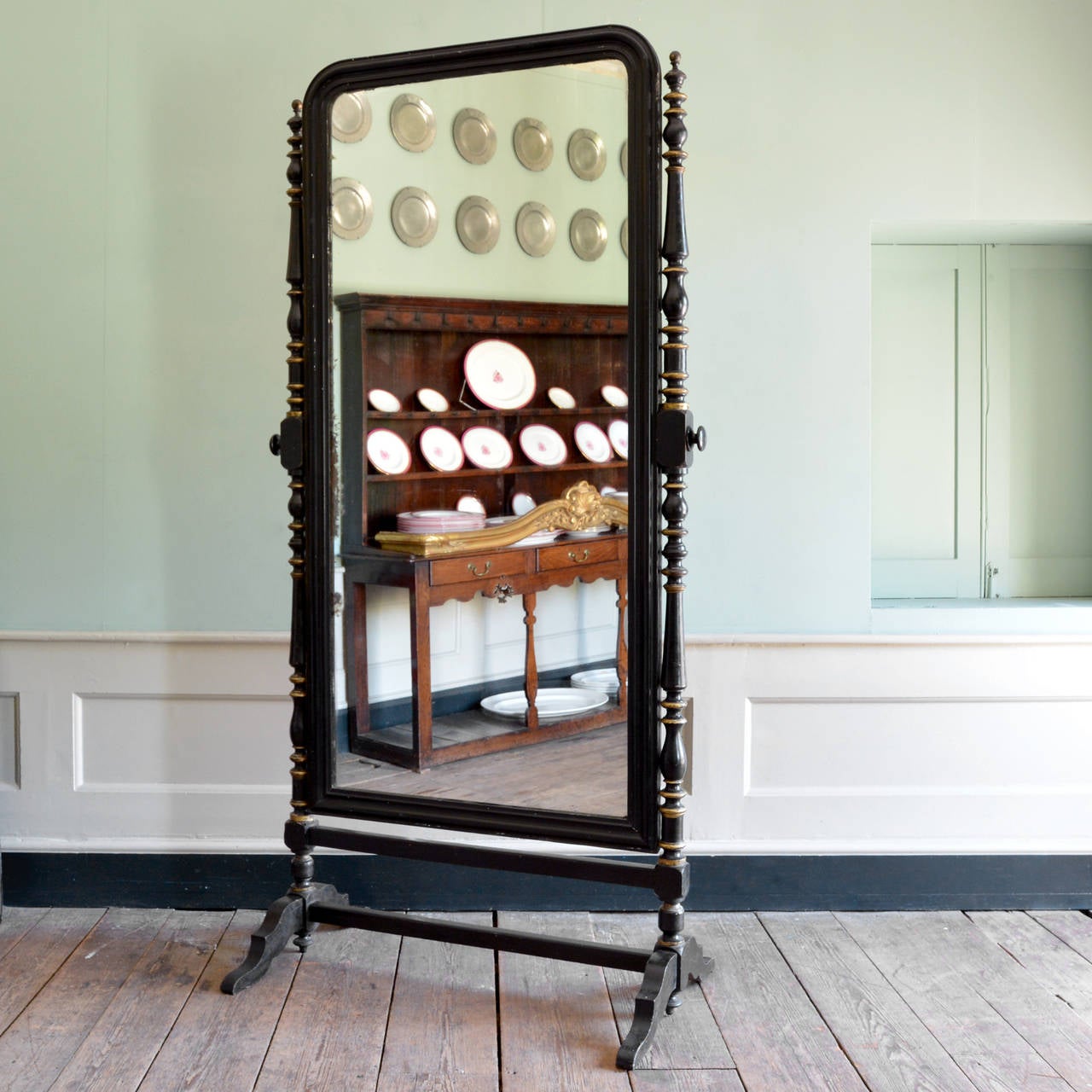 An enormous ebonised cheval mirror, parcel-gilt with original plate glass, mid-Victorian.

Available to view at Brunswick House.

Dimensions:
Height 223 cm
Width 103 cm
Depth 65.5 cm