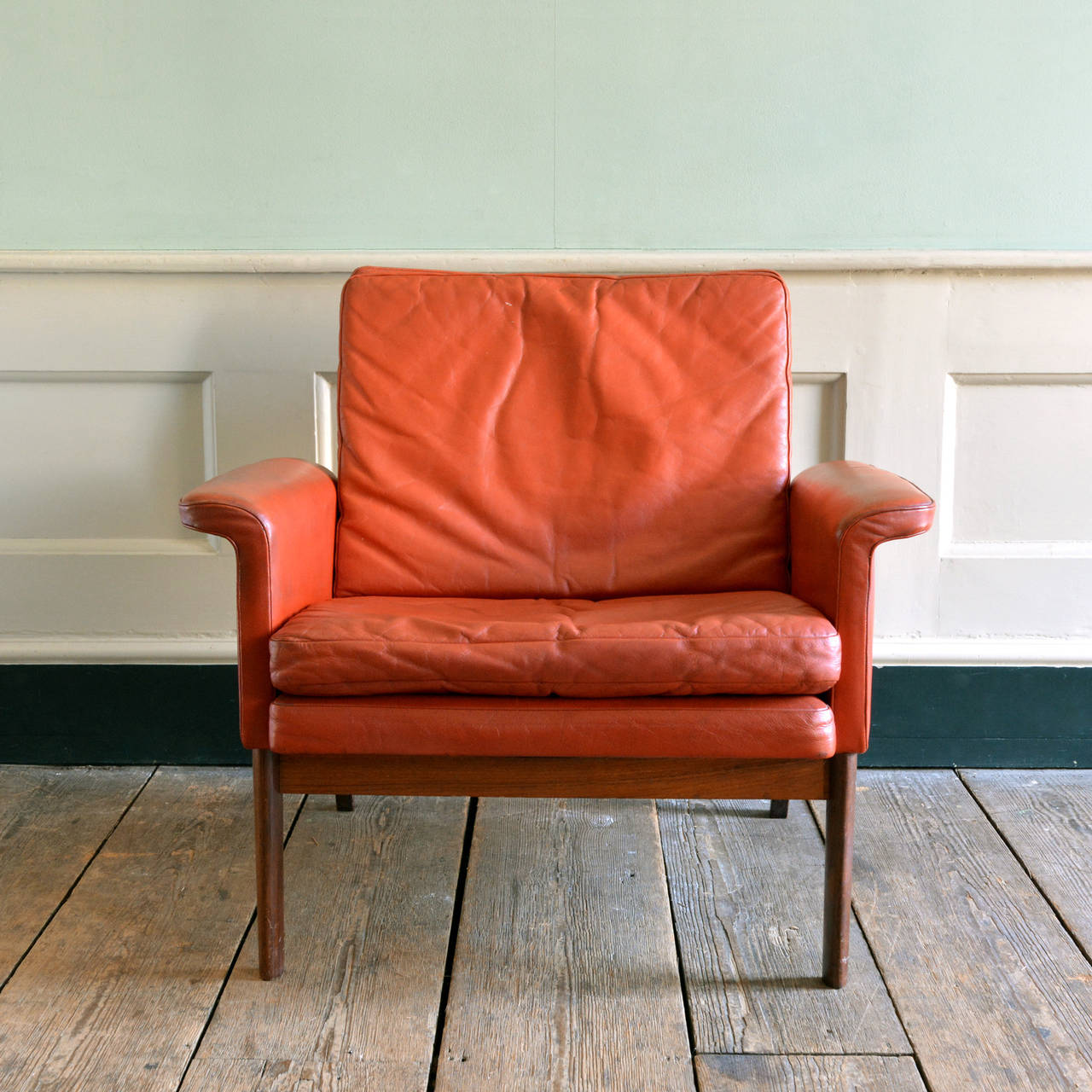 A Danish red leather and rosewood easy chair,by Finn Juhl for Frank and Son, model 218 'Jupiter', circa 1965. 

Available to view at Brunswick House, London.

Dimensions: 76cm (30