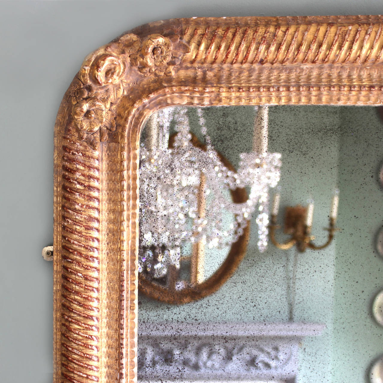 A late nineteenth century French giltwood mirror, with attractive foxed original plate.

Available to view at Brunswick House, London.

150cm high, 99.5cm wide.