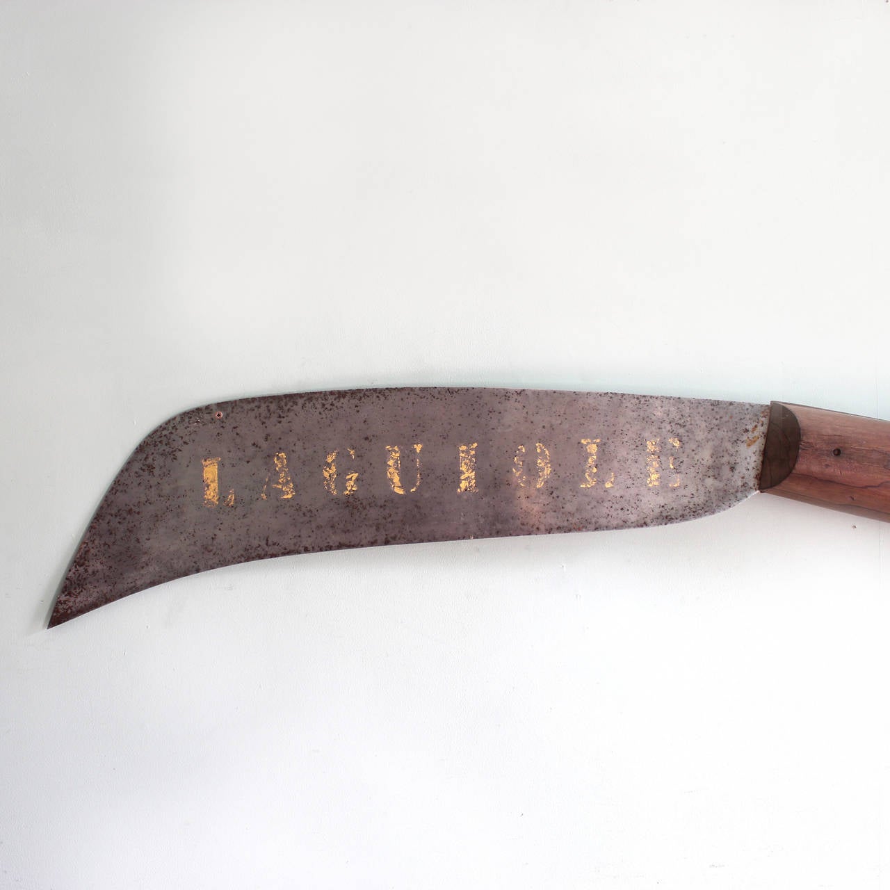 A late 19th century French trade sign, with timber handle, steel blade and old lettering 'LAGUIOLE'.

Available to view at LASSCO Brunswick House.

Dimensions:
width 139 cm 
height 21 cm
depth 11 cm