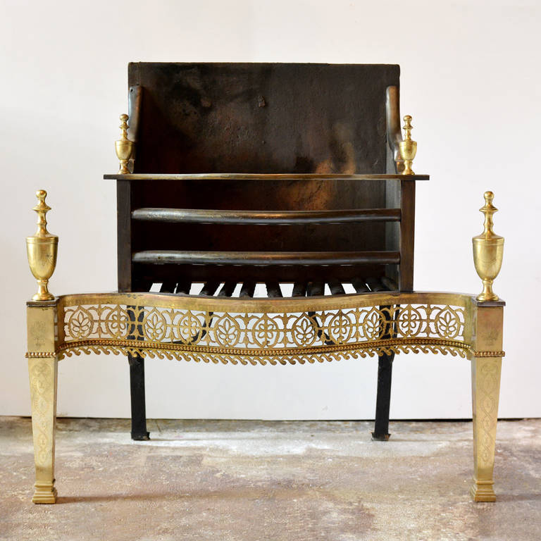 An eighteenth century brass, steel and cast iron fire basket, with classical urn finials and pierced fretwork serpentine apron.

Height 76cm, width 81.5, depth 33cm.

Available to view to Brunswick House, London.