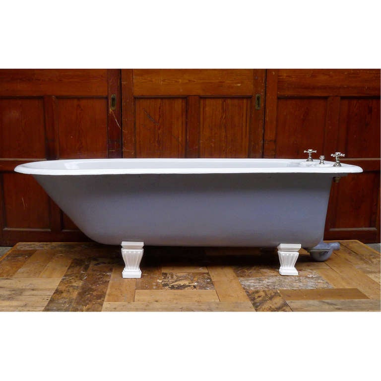 A late Victorian cast iron bath, the concealed taps and waste mounted on cast shelf with floral soap dishes.
Restored with vitreous enamel and brassware in nickel.

'Shanks and Co. Patentees Ltd.'

The width of the bath tapers to 61cm from