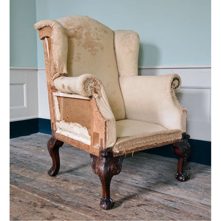 A George II style mahogany armchair, the front cabriole legs carved with acanthus, scrolled ears and claw and ball fee. 

Available to view at Brunswick House, London.