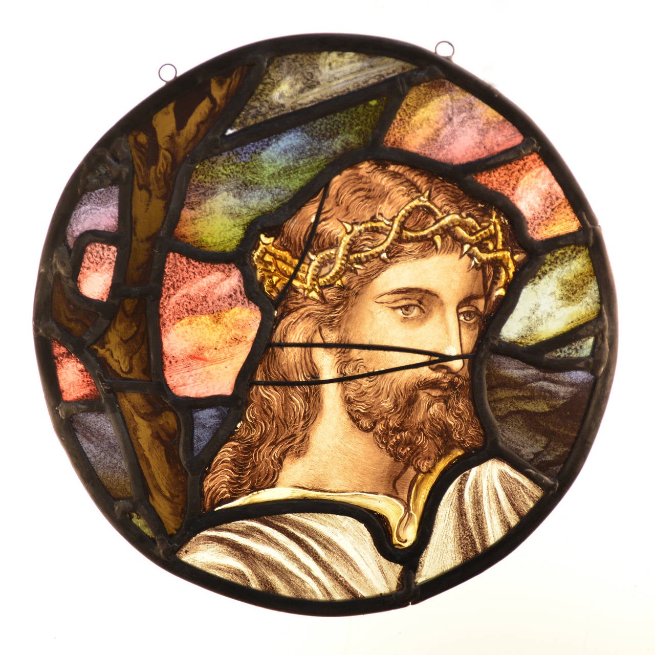 A Late Victorian stained and painted glass roundel of Jesus with a crown of thorns, by Cottier & Co. of London, circa 1890.  Removed from St. George's Church, Perry Hill, Catford.

Available to view at Brunswick House, London.

Diameter 32cm.