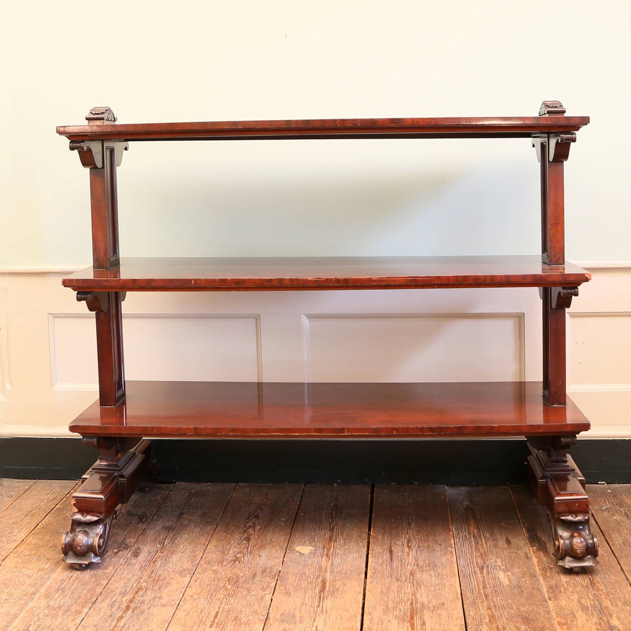 Three early Victorian mahogany buffets, the three tiers supported by scrolled brackets.

Available to view at Brunswick House, London.

Height 124cm, width 152cm, depth 52cm.