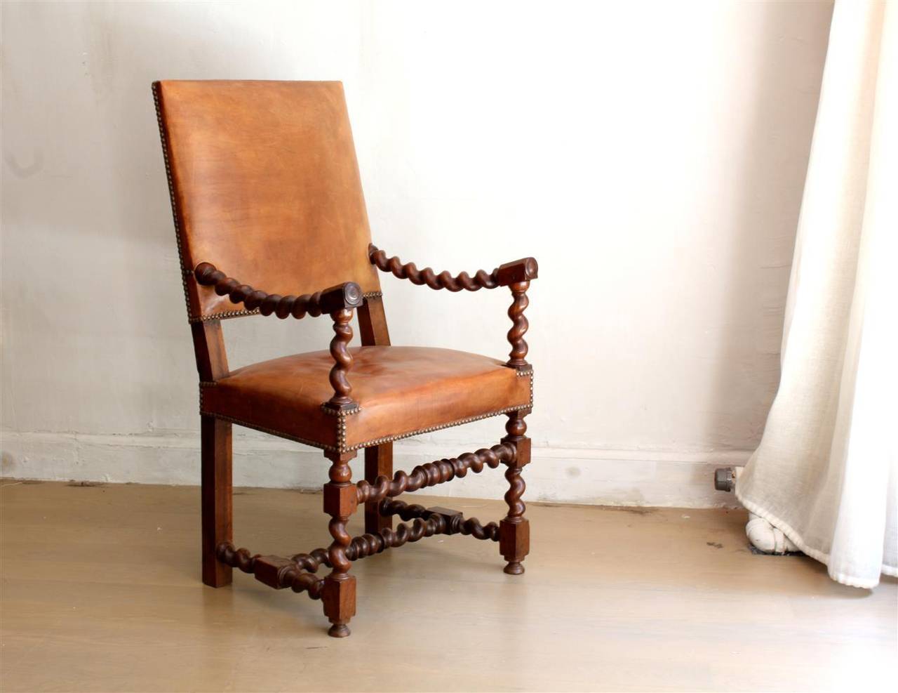 DETAILS
- French walnut barley twist armchair
- Vintage leather
- Nail heads

ORIGIN
- France, 19th century
