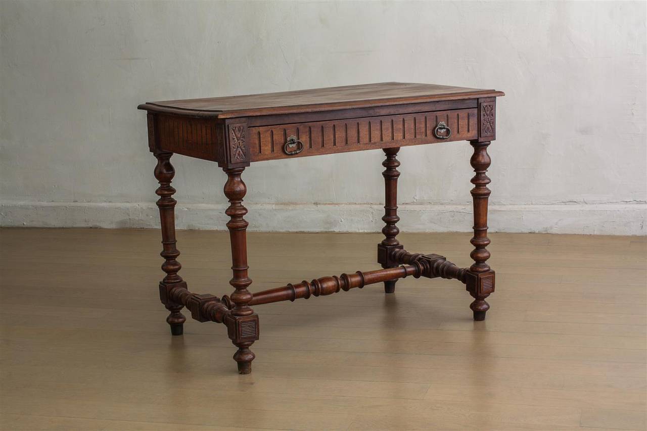 DETAILS
- Walnut side table with single drawer, carved detail and brass hardware

ORIGIN
- France, 19th century