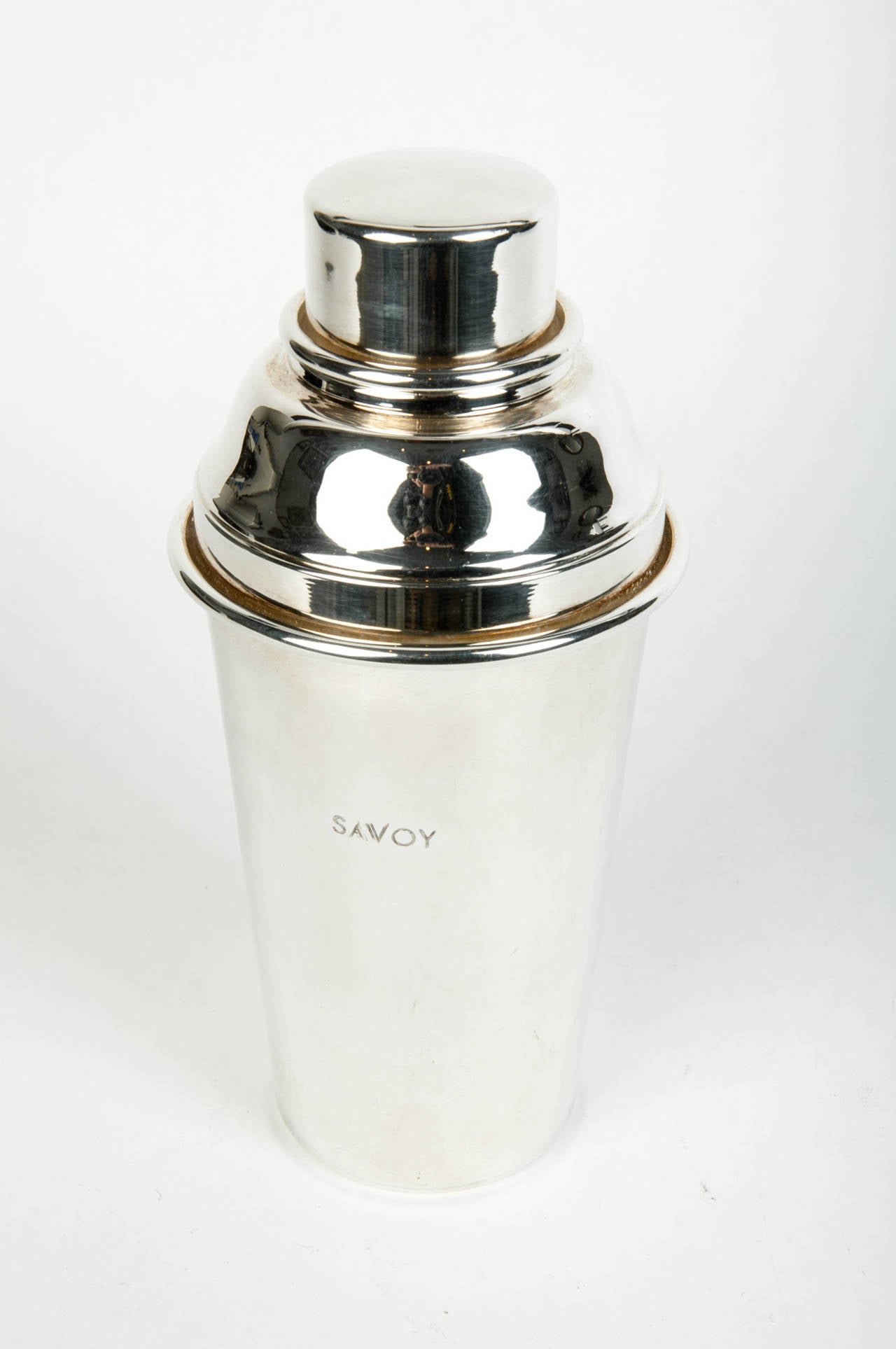 A vintage 1940s English pewter cocktail shaker from the Savoy hotel in London.