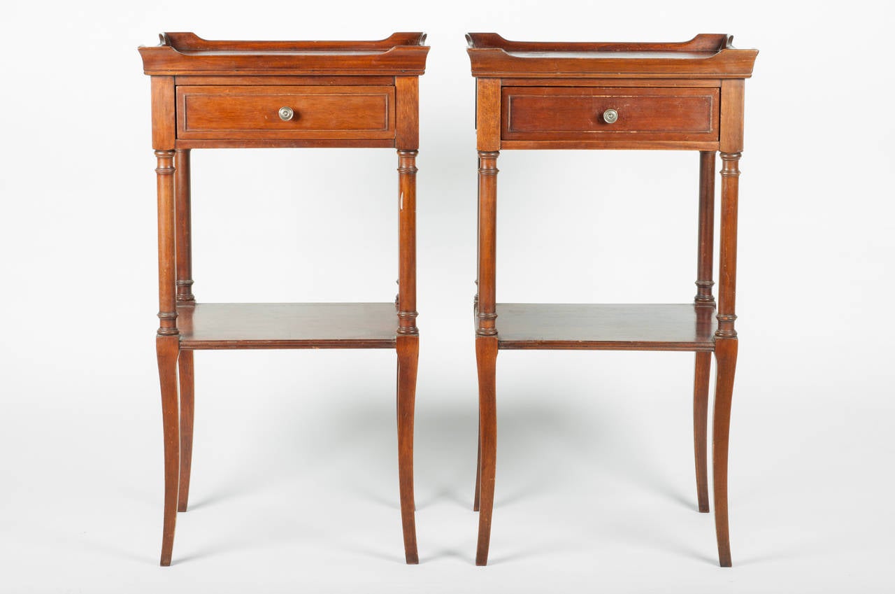 A vintage pair of light mahogany side tables or nightstand tables with detachable drawer.