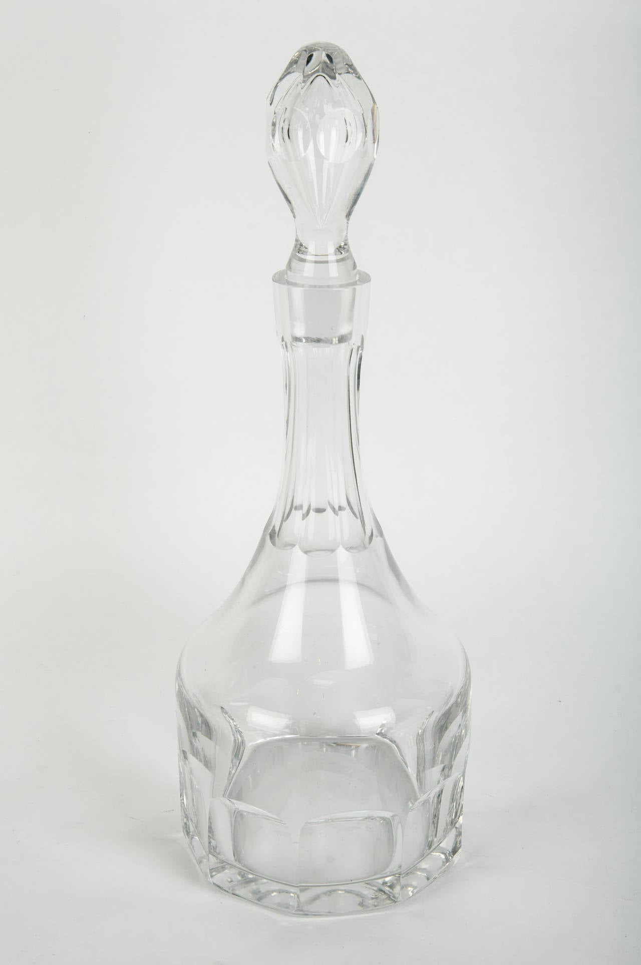 An antique French cut crystal decanter with cut crystal lid.