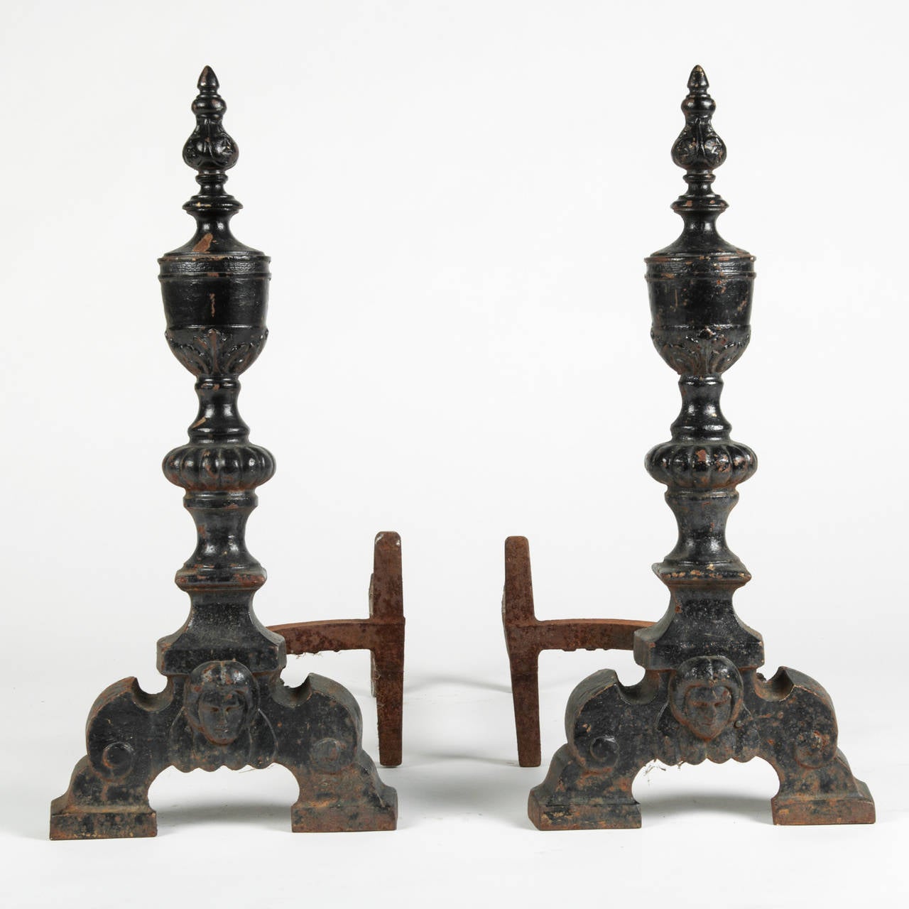 A pair of antique wrought iron andirons.