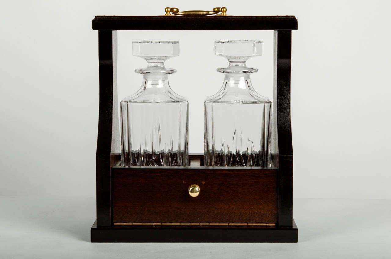 A pair of vintage crystal cut decanter set in a wooden caddie box. Excellent condition.