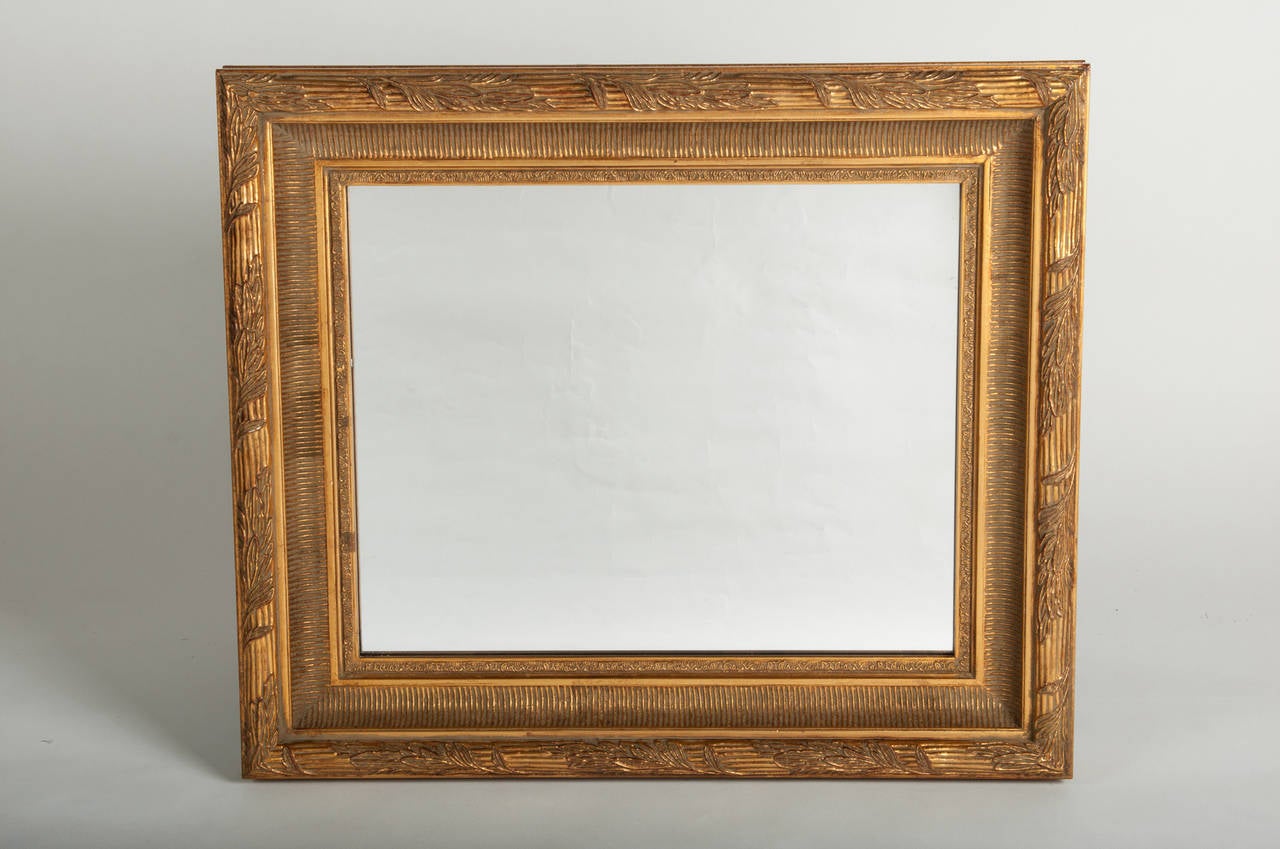 A vintage gold leaf wooden wall mirror. Excellent condition.