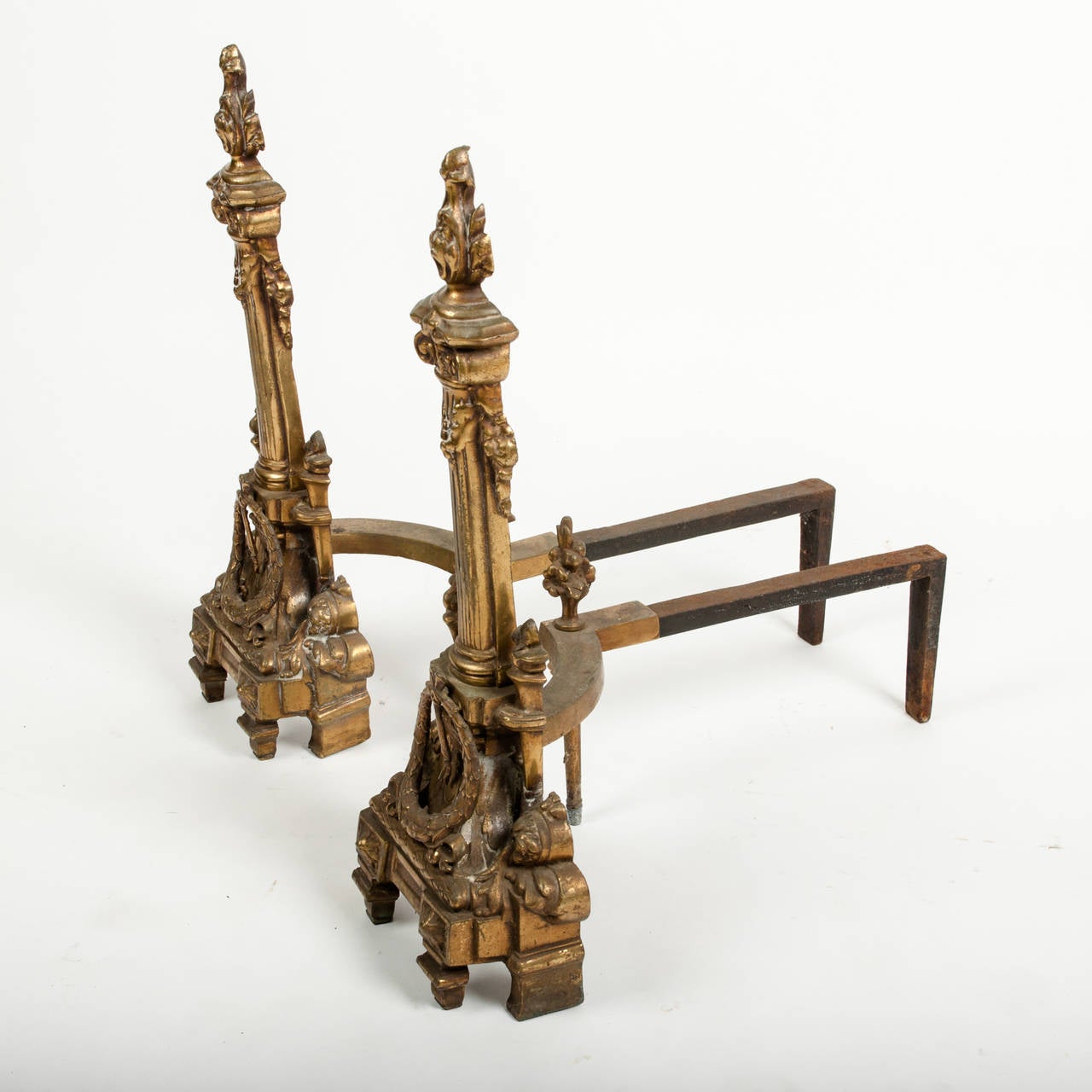 A vintage pair of ornate bronze andirons signed 