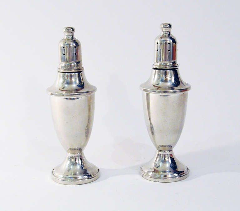 Pair of pewter salt and pepper shakers.