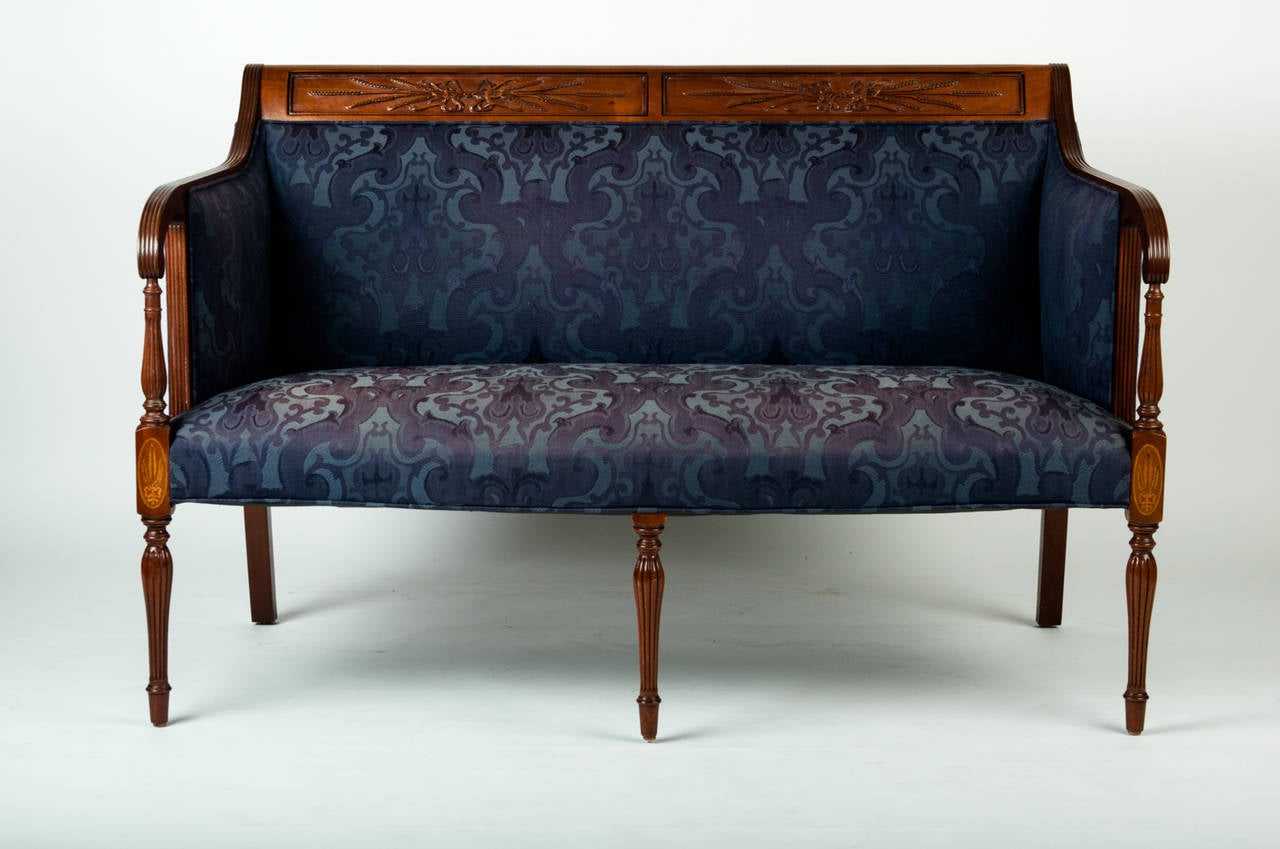 Vintage settee with fluted legs and blue damask upholstery. Inlay of traditional wheat design at top of front legs. Beautiful fluted detail along legs and arms.