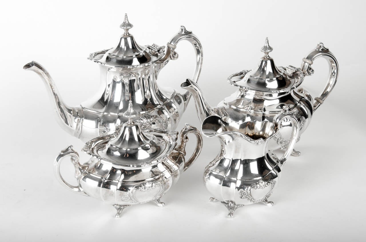 Vintage American  Sterling Silver Tea and Coffee Service. Maker's Mark on Each Piece Reed  & Barton, Taunton, MA., in the Hampton Court Pattern, 20th century. The Set include 4 pieces.  All in Excellent Condition. The Coffee Pot Measure 11.5 inches