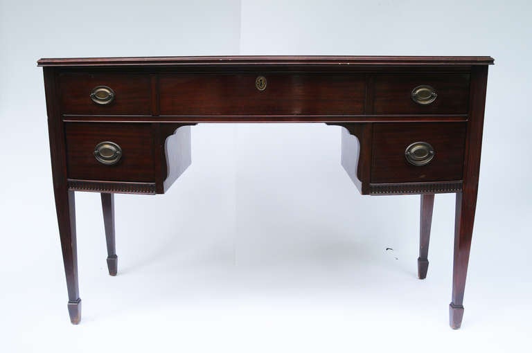 Hepplewhite style mahogany desk with 5 drawers.