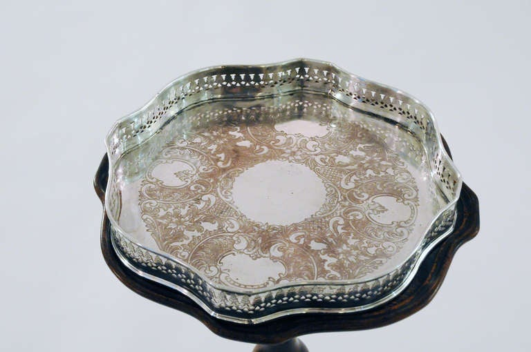 Small round English tea table with scalloped top and scalloped silver plated removable tray
