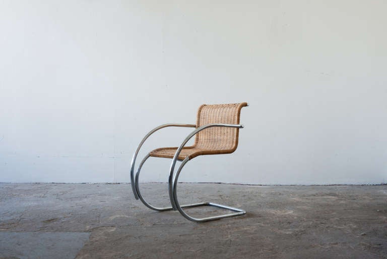 The famous cantilevered tubular steel chair by Ludwig Mies van der Rohe, wrapped in cane. Influenced by the early cantilever designs by Mart Stam. Wonderfully comfortable- firm with just the right amount of give.