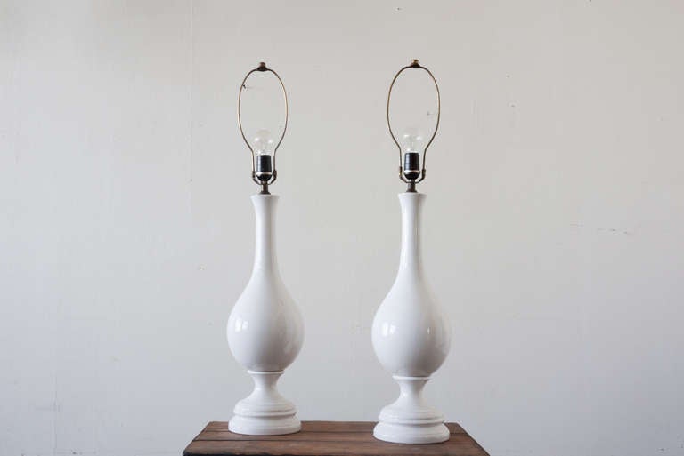 This pair of turned Blanc de Chine lamps are elegant, yet pared-down in the transitional style. They have been rewired and fitted with new old stock sockets.