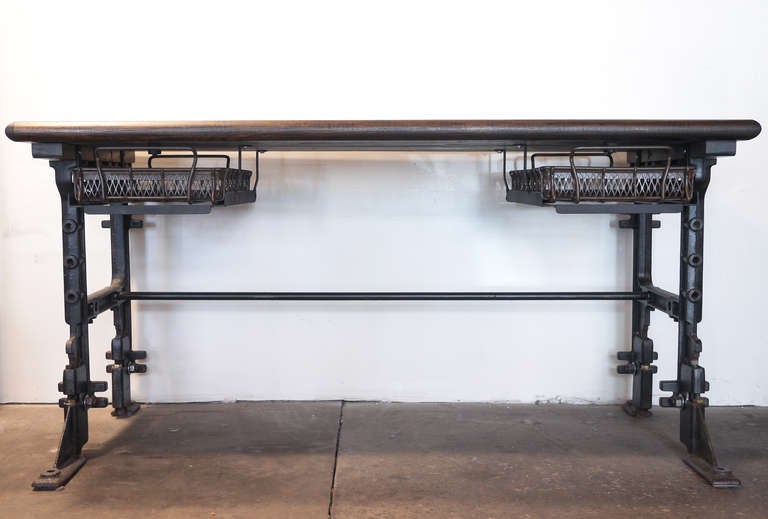 Industrial desk with factory baskets and a reclaimed wood top.