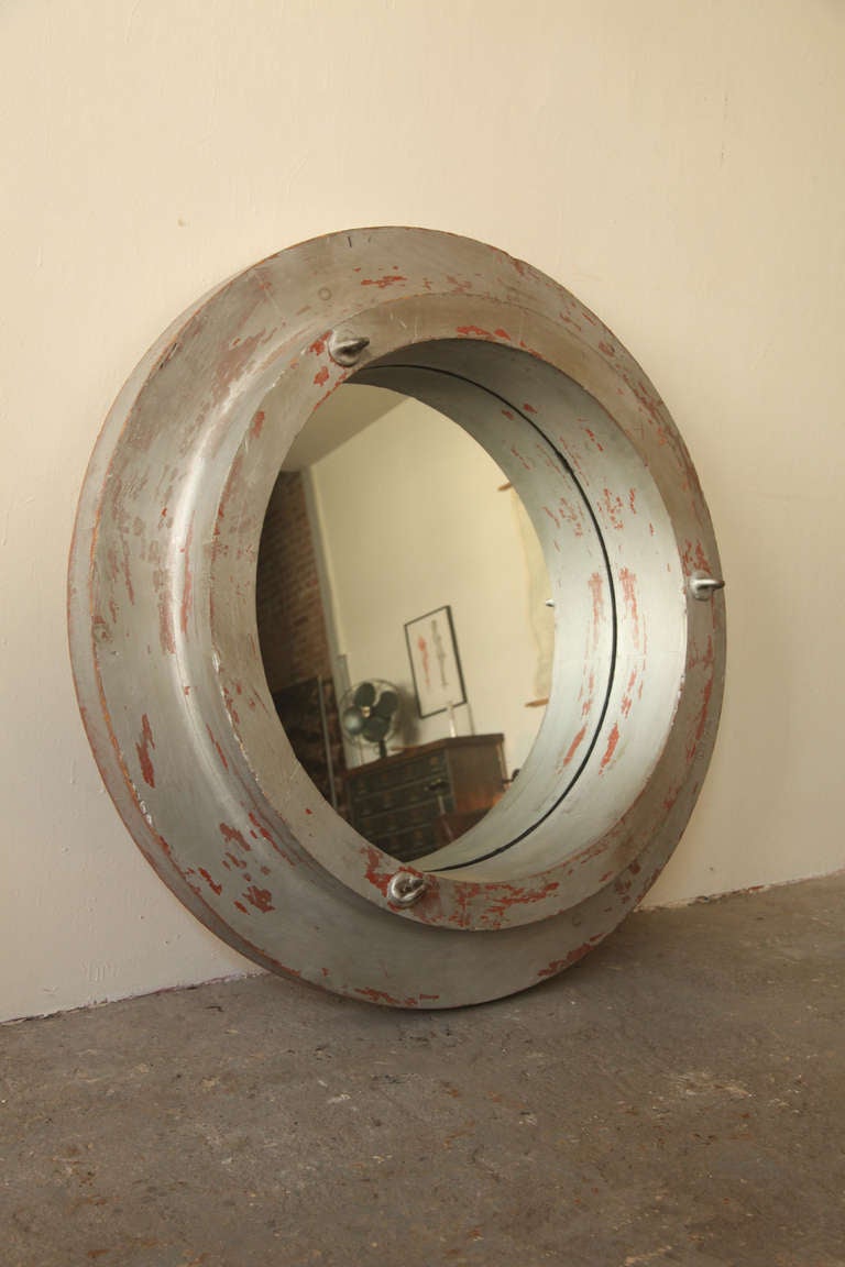 Industrial wood cast factory mold repurposed as a mirror.
