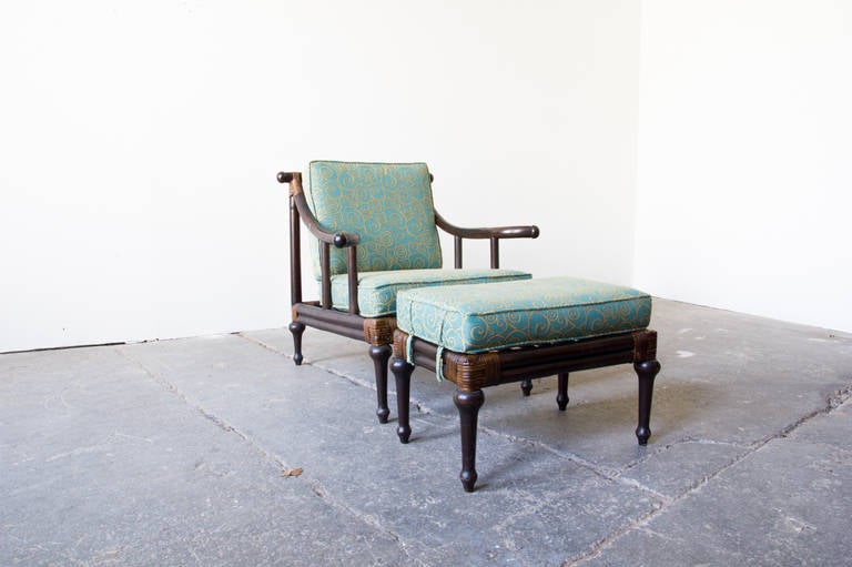 A lacquered rattan lounge chair with ottoman by Henry Olko for Willow & Reed. From the Pagoda line, these pieces harken eastern design tropes yet are sober and modern. The cushions have been reupholstered in a curly-cue jade and gold print.