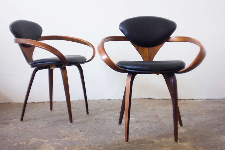 This pair of Cherner Pretzel Chairs for Plycraft feature leather seat and back cushions. These chairs are exemplary of the stunning bentwood style for which Plycraft was known. The original tag can be found on the underside of each chair.

We have