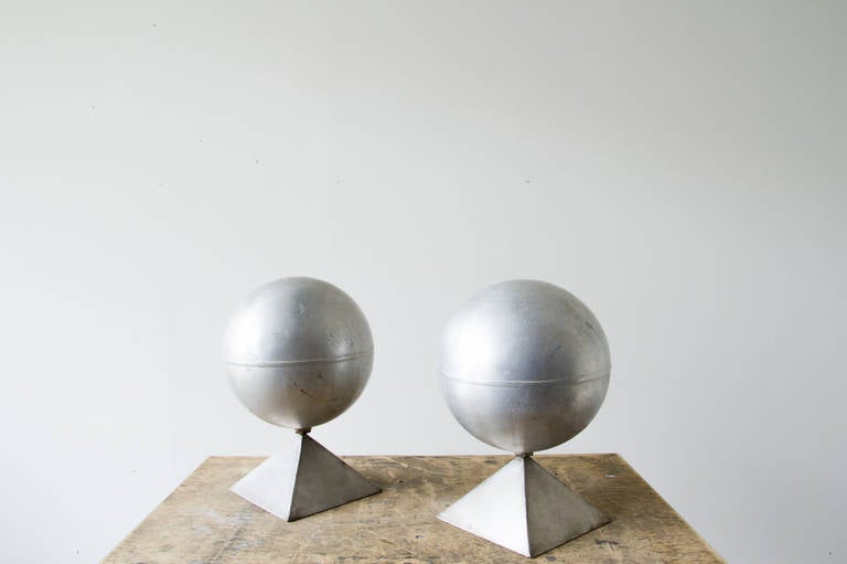 These floats feature hand-welded steel bases and aluminum balls. Their shapes, removed from the context of Industrial use, harken the look of desk globes from Art Deco.