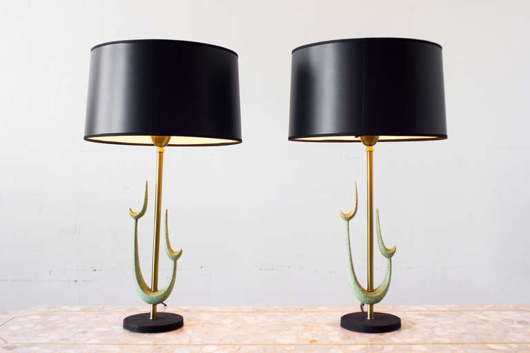 Green 1960s sculpture table lamps with milk glass shades and black barrel shades to fit over.