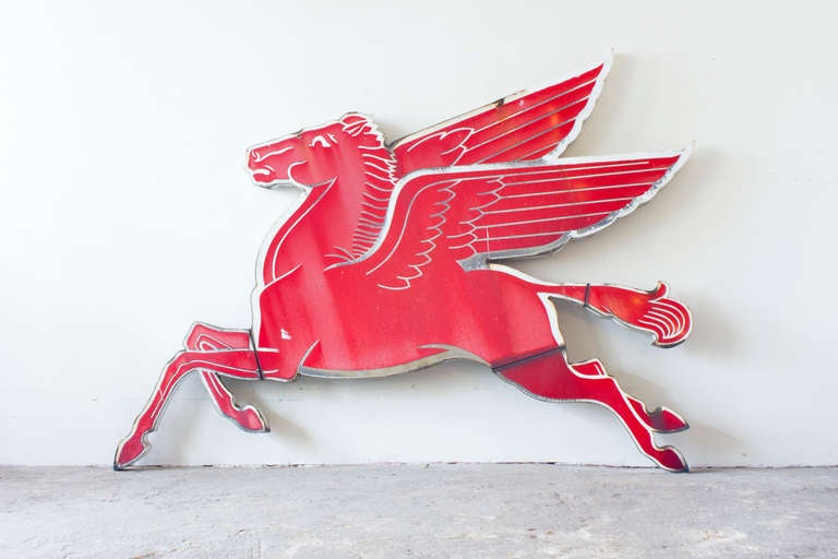 This iconic and original Pegasus sign is made of steel, painted in red and white. There are mounting brackets on the back making it easy to repurpose this beacon of gas for the home setting.