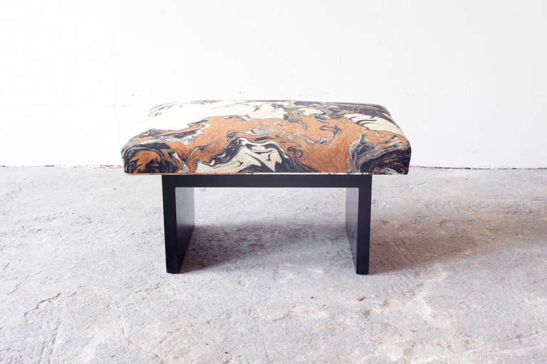 This Regency style bench stands on a black wooden frame. The seat has been newly reupholstered in a geological motif fabric.