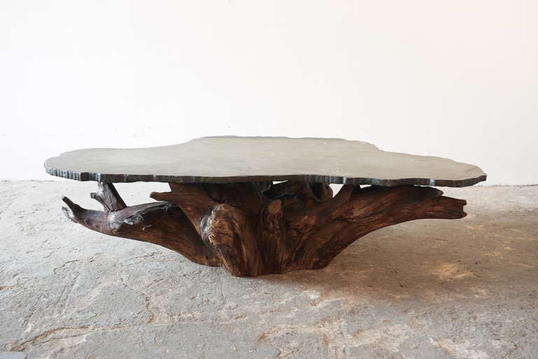 This one of a kind coffee table is comprised of found tree material, with a custom stone top by Craft Associates. Despite the craftsmanship, this table appears to have taken shape organically.