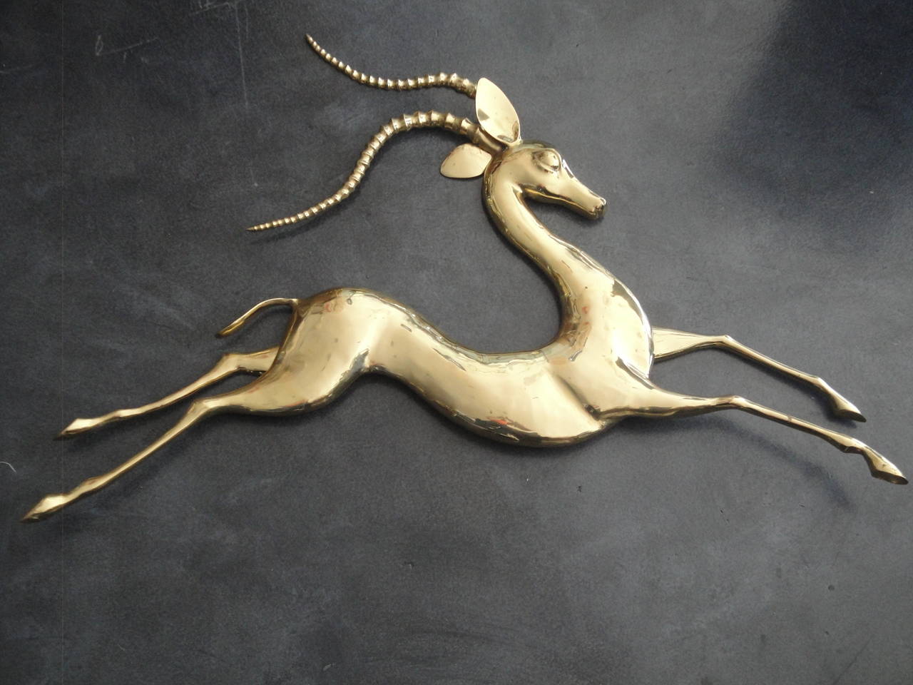 Brass antelope wall sculpture by Bijan.